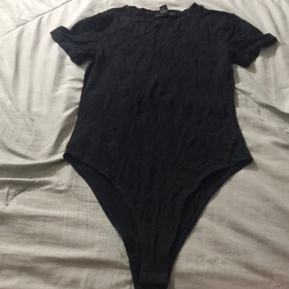 A black short sleeve shirt that connects at the bottom size small!